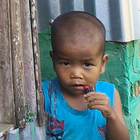 young-child-holding-object